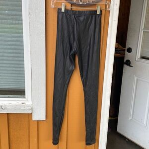 American Apparel woman’s black coated leggings